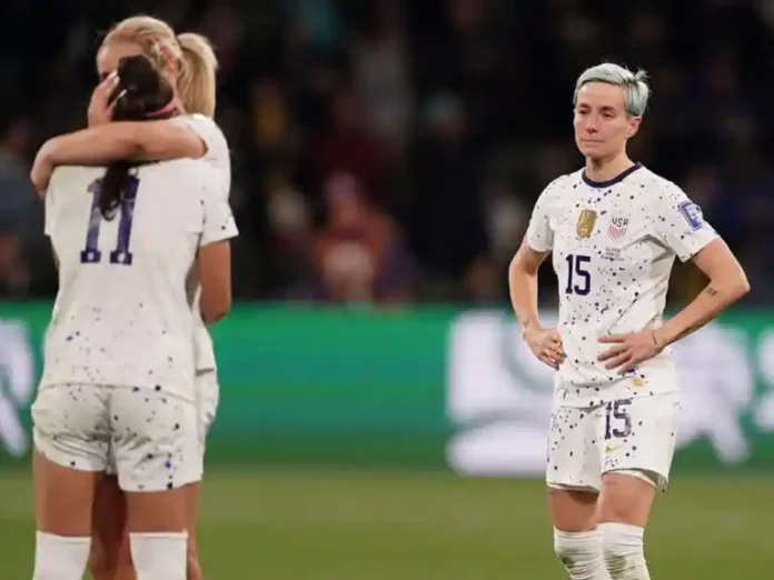 United States' Megan Rapinoe, right, reacts with her teammates following their loss to Sweden in their Women's World Cup round of 16 soccer match in Melbourne, Australia, Sunday, Aug. 6, 2023.
